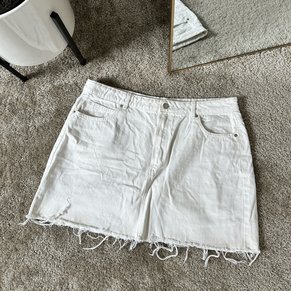 Distressed denim mini skirt